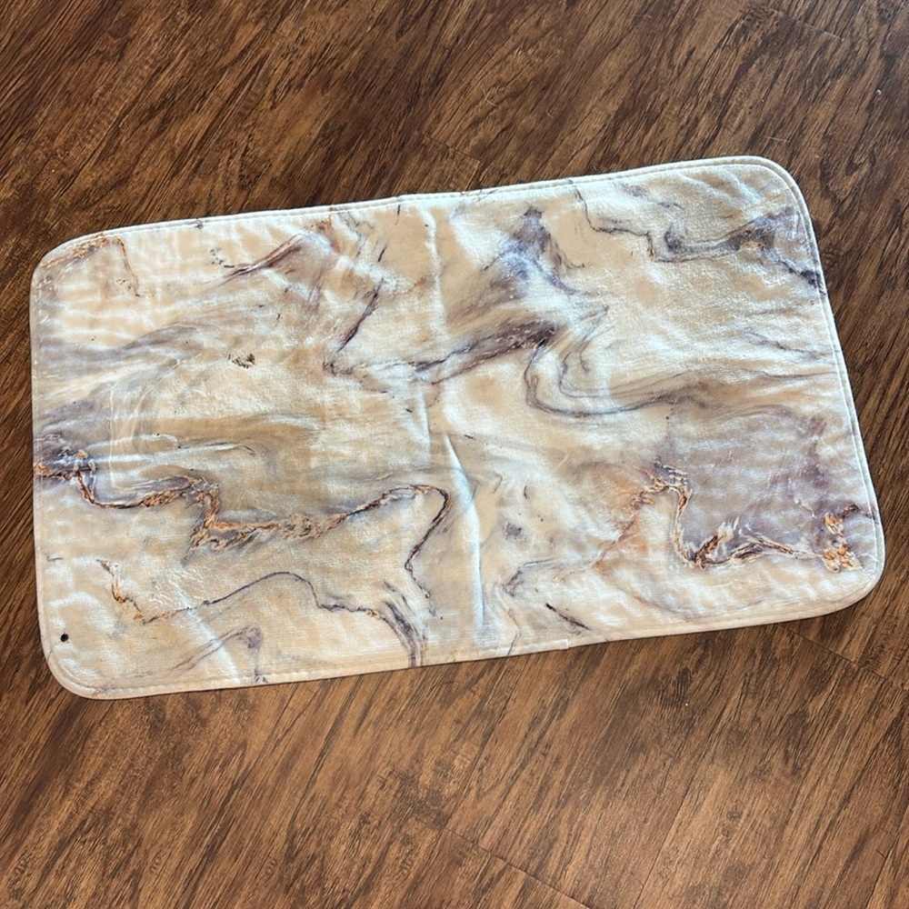 White marble bathroom mat